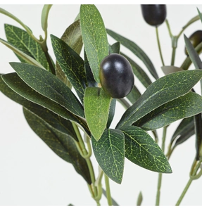 Detailed close-up showing the realistic leaf texture and black fruit of the artificial olive branch