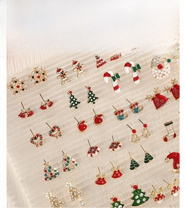 Detailed set of Christmas stud earrings including snowflake and reindeer holiday motifs