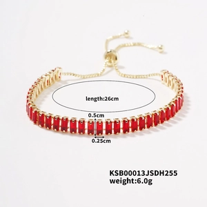 Detail view of 26cm adjustable gold bracelet with red zircon baguette stones and dimensions