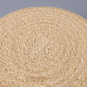 Flat top raffia sun hat with colorful bow, featuring detailed hand-woven texture