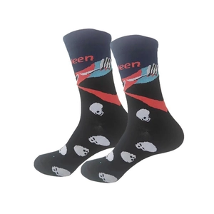 Detail of Halloween crew socks featuring white skulls and red lettering on black knit