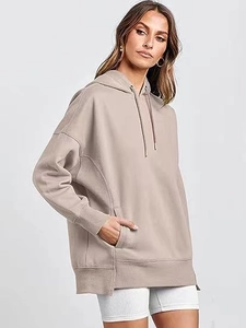Detail of oversized solid hoodie with kangaroo pocket and ribbed cuffs in taupe