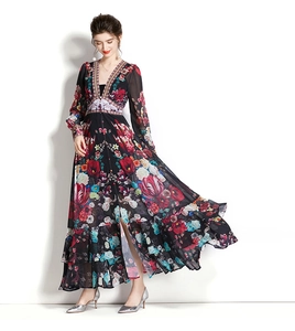 Close-up of elegant floral print dress featuring vibrant tulips and ruffled hem detail