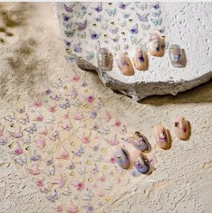 Detailed close-up of M-1068 butterfly nail stickers with gold foil outlines and 3D effects