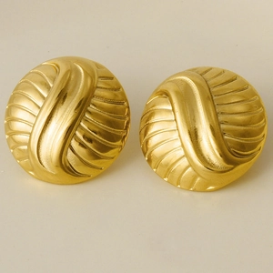 Close-up of 304 stainless steel earrings with gold spiral texture and round design