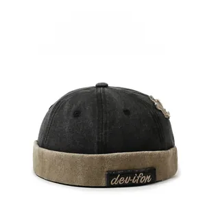 Close-up of color-block docker hat with distressed details and devifon woven label