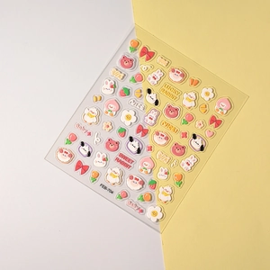 Close-up of 3D puffy nail art stickers featuring cute cartoon rabbit and bear designs