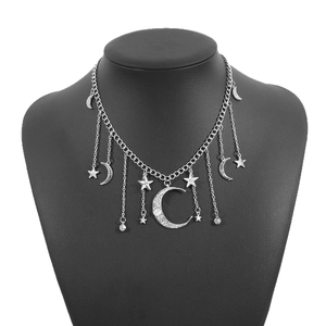 Silver star and moon fringe necklace with sparkling rhinestones on a black neck model