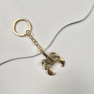 Golden alloy scorpion keychain with detailed metal pendant and durable keyring