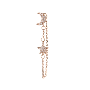 Détail de boucles d'oreilles lune et étoile en or rose avec cristaux pavés