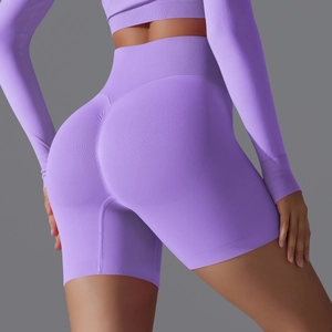 Detailed view of seamless high-waist purple yoga shorts with scrunch butt lift texture