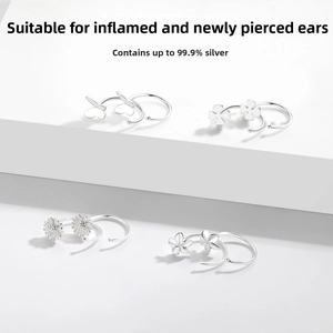 Detail view of S999 sterling silver stud earrings in flower and butterfly shapes