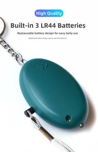 Detail showing the internal battery compartment with three LR44 cells for the personal alarm