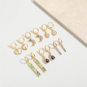 Golden drop earrings set featuring heart moon and evil eye designs on white stone