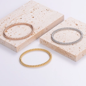 Minimalist stainless steel bead bangle set in gold, silver, and rose gold finishes