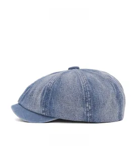 Side view of washed denim newsboy cap with eight-piece panel tailoring and top button