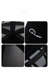 Close-up of black mesh trucker hat with snapback closure and embroidery details