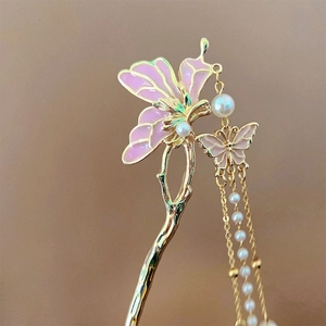 Elegant gold butterfly hair stick with pink enamel, white pearls, and long tassels