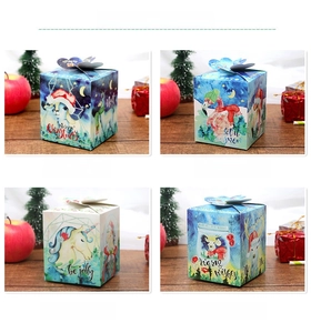 Detailed view of four Christmas gift boxes with deer and unicorn festive illustrations