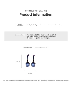 Detail view of flower earrings with purple pearls and dimensions 5.3cm by 1.5cm
