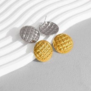 Minimalist gold and silver stainless steel hoop earrings with quilted diamond pattern