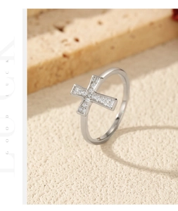 Detail of silver S925 sterling silver cross ring with pavé moissanite stones