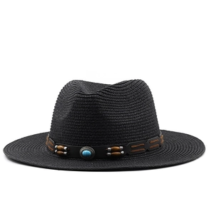Detail of black straw fedora hat with turquoise bead and leather bohemian decoration
