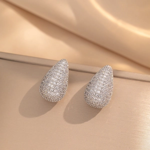 Sparkling teardrop stud earrings with pavé set cubic zirconia in silver finish