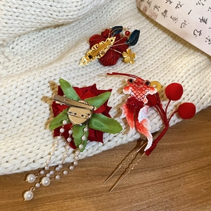 Detail of Chinese style hair clip set with red roses, silk goldfish and pearl tassels