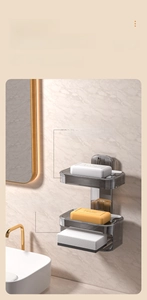 Close-up of double-layer wall-mounted grey soap dish with drainage and water-absorbing sponge