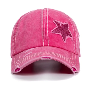 Deep pink washed cotton ponytail baseball cap with sequin star and distressed holes