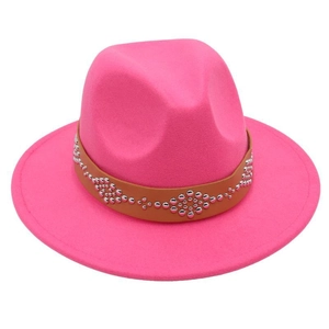 Detail of rose pink wool fedora hat featuring a brown belt with silver metal rivets