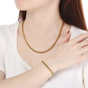 Golden stainless steel pig nose chain set with matching necklace and bracelet for women