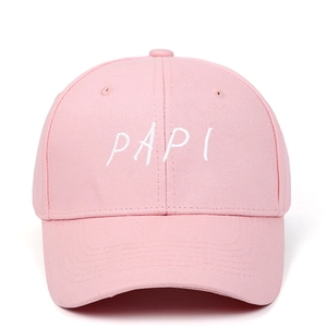 Close-up of white PAPI embroidery detail on a pink cotton twill baseball cap