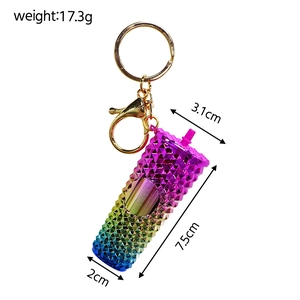 Detail view of mini rainbow studded keychain showing size dimensions and weight specifications