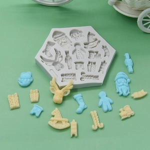 Hexagonal silicone mold with Christmas patterns like Santa, reindeer and gingerbread man