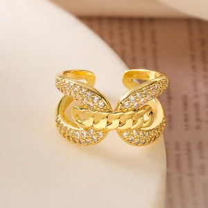 Detailed view of 18K gold plated ring with cubic zirconia on elegant ceramic prop