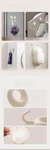 Detail showing strong adhesive hooks in cream white for bathroom and kitchen storage