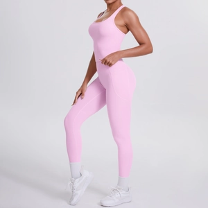 Close-up of light pink yoga set featuring high waist leggings with functional side pockets