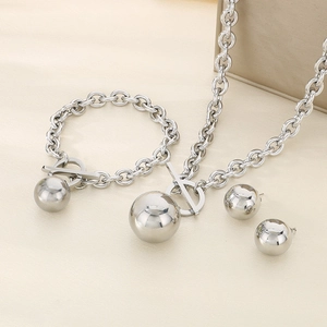 Detailed view of silver steel jewelry set with large spheres and OT toggle clasp
