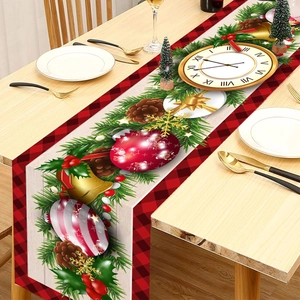 Christmas table runner with bells and pine cones on a rustic white wood background