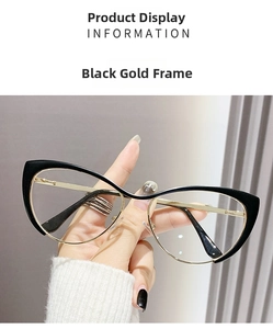 Detail of cat-eye black and gold metal glasses frames held for size perspective