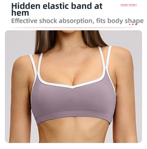 Close-up of purple sports bra with white trim and elastic band for support