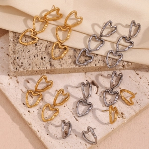 Lava texture heart drop earrings in 18K gold and silver minimalist liquid metal style