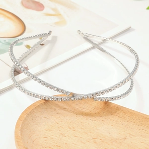 Elegant silver X-shaped headband featuring double-layer crisscross rhinestones on a tray