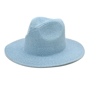 Close-up of light blue straw fedora hat featuring a classic crown and breathable weave