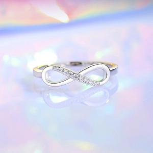 Elegant S925 silver infinity ring with sparkling white diamonds on a dreamy background
