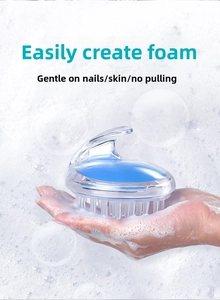 Silicone scalp massage brush with ergonomic handle creating rich foam for hair washing