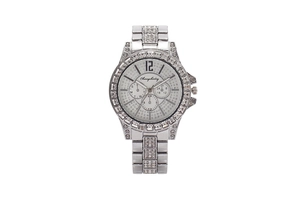 Macro detail of silver watch dial featuring iced-out crystal pavé and luxury sub-dials