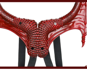 Close-up of dark red dragon wings with detailed scale texture and elastic straps